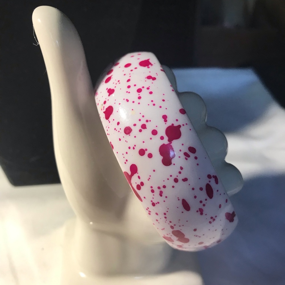 White bangle with splats of fuschia bracelet